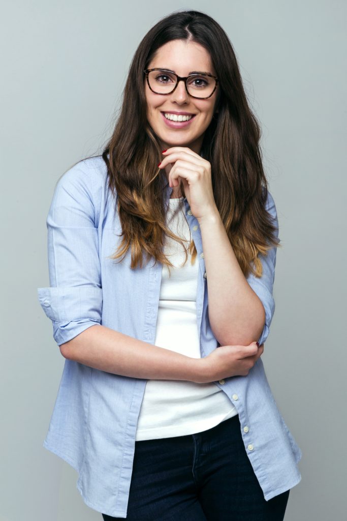 beautiful young woman looking camera